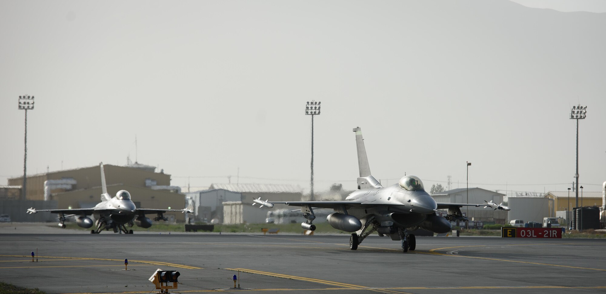 F-16 Fighting Falcons taxi off the runway at Bagram Airfield, Afghanistan, May 19, 2017. F-16s from the 555th Expeditionary Fighter Squadron are deployed out of Aviano Air Base, Italy, as part of a constant rotation of fighter aircraft to Afghanistan. (U.S. Air Force photo by Staff Sgt. Benjamin Gonsier)