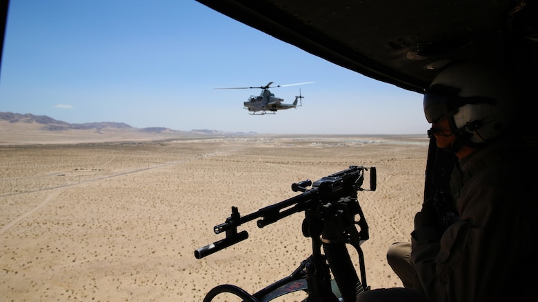 Lance Cpl. Gregory Ybarra, a Marine Light Attack Helicopter Squadron (HMLA) 469 UH-1Y crew chief, stands by to provide cover fire during a tactical recovery of aircraft and personnel (TRAP) training mission for Integrated Training Exercise (ITX) 3-17 at Marine Corps Air Ground Combat Center Twentynine Palms, Calif., May 17. ITX is a combined-arms training exercise enabling Marines across 3rd Marine Aircraft Wing to operate as an aviation combat element integrated with ground and logistics combat elements as a Marine air-ground task force. More than 650 Marines and 27 aircraft with 3rd MAW are supporting ITX 3-17. 