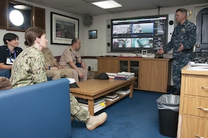 Capt. Christopher Wells, commanding officer of Afloat Forward Staging Base (Interim) USS Ponce (AFSB(I)-15), discusses Ponce’s capabilities with participants of the International Maritime Exercise (IMX) 2017. IMX is a command post exercise and includes more than 20 partner nations to promote interoperability, increase readiness in all facets of defensive maritime warfare and demonstrate resolve in maintaining regional security and stability and protecting the free flow of commerce. (U.S. Navy photo by Mass Communication Specialist 1st Class Grant P. Ammon)