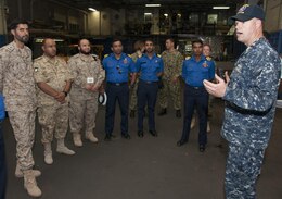 Lt. Mick Kalman discusses the capabilities of Afloat Forward Staging Base (Interim) USS Ponce (AFSB(I)-15) with participants of the International Maritime Exercise (IMX) 2017. IMX is a command post exercise and includes more than 20 partner nations to promote interoperability, increase readiness in all facets of defensive maritime warfare and demonstrate resolve in maintaining regional security and stability and protecting the free flow of commerce. (U.S. Navy photo by Mass Communication Specialist 1st Class Grant P. Ammon)