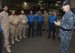 Lt. Mick Kalman discusses the capabilities of Afloat Forward Staging Base (Interim) USS Ponce (AFSB(I)-15) with participants of the International Maritime Exercise (IMX) 2017. IMX is a command post exercise and includes more than 20 partner nations to promote interoperability, increase readiness in all facets of defensive maritime warfare and demonstrate resolve in maintaining regional security and stability and protecting the free flow of commerce. (U.S. Navy photo by Mass Communication Specialist 1st Class Grant P. Ammon)