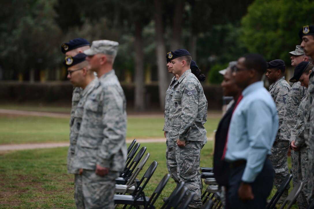 Airmen assigned to the 39th Air Base Wing bow their heads for a moment of silence, during the Incirlik Police Week 2017 closing ceremony May 18, 2017, at Incirlik Air Base, Turkey. National Police Week began in 1962 after President John F. Kennedy signed a proclamation designating May 15 as Peace Officers Memorial Day and the week in which that date falls as Police Week. (U.S. Air Force photo by Airman 1st Class Devin M. Rumbaugh)