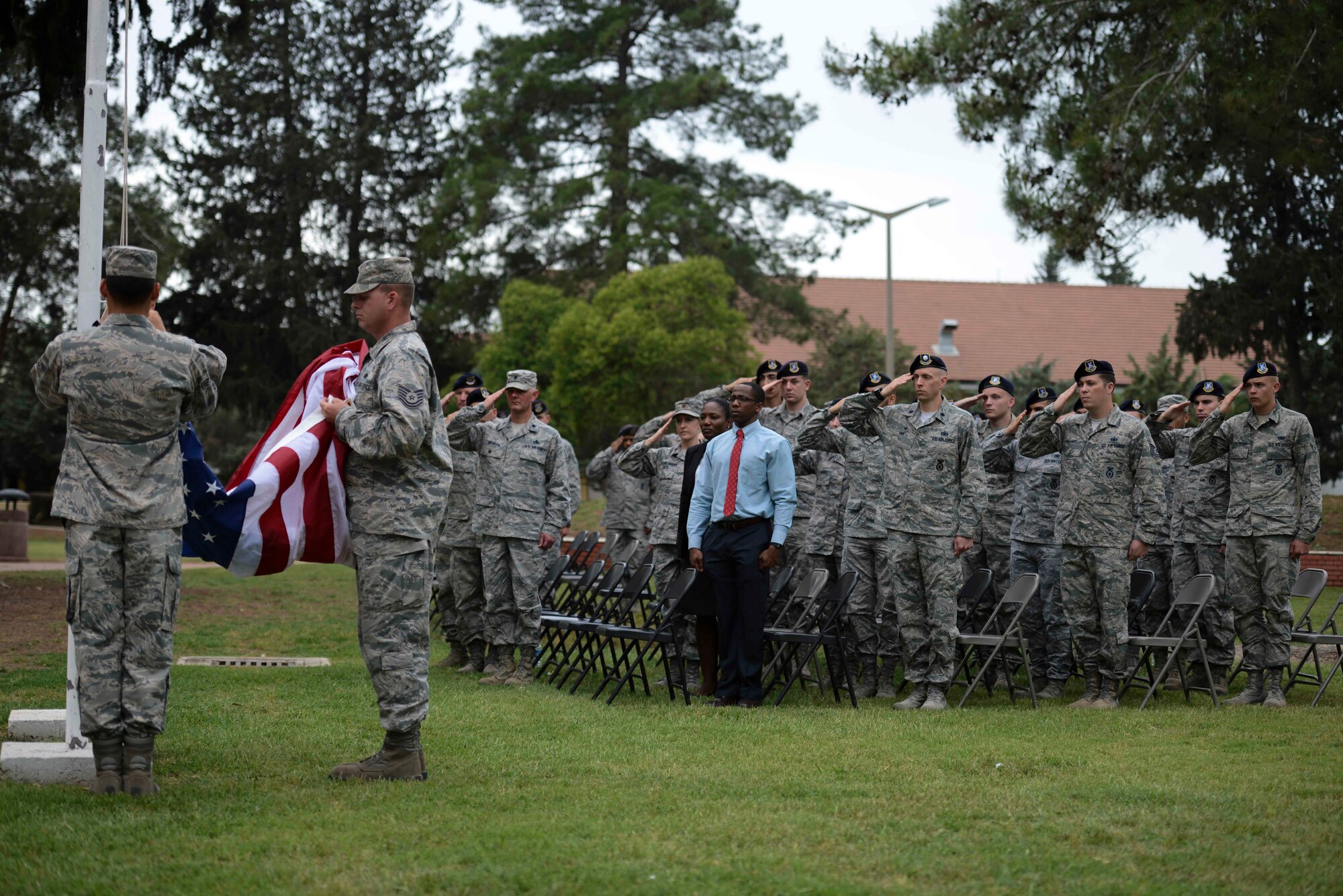 Airmen assigned to the 39th Air Base Wing salute the American flag during the Incirlik Police Week 2017 closing ceremony May 18, 2017, at Incirlik Air Base, Turkey. National Police Week began in 1962 after President John F. Kennedy signed a proclamation designating May 15 as Peace Officers Memorial Day and the week in which that date falls as Police Week. (U.S. Air Force photo by Airman 1st Class Devin M. Rumbaugh)