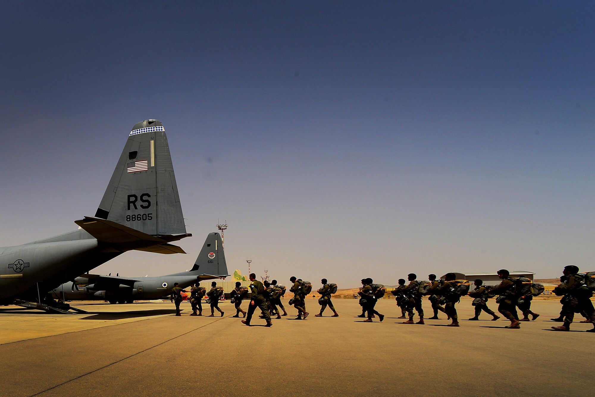 Israeli Defense Force paratroopers board a C-130J Super Hercules assigned to the 37th Airlift Squadron, 86th Airlift Wing, Ramstein Air Base, Germany, prior to an airdrop sortie in support of exercise Juniper Falcon May 15, at Nevatim Air Force Base, Israel. Juniper Falcon 17 represents the combination of sseveral bi-lateral component exercises with Israel Defense Forces that have been executed annually since 2011. These exercises were combined to increase joint training opportunities and capitalize on transportation and cost efficiencies gained by aggregating forces.   (U.S. Air Force photo/ Tech. Sgt. Matthew Plew)