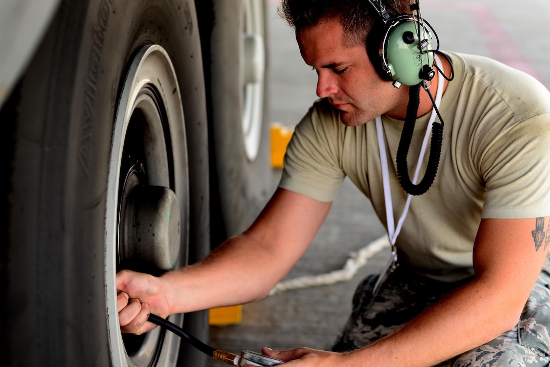 An Airman assigned to the 86th Aircraft Maintenance Squadron, 86th Airlift Wing, Ramstein Air Base, Germany, checks the tire pressure of a C-130J Super Hercules prior to a sortie in support of exercise Juniper Falcon May 14, at Nevatim Air Force Base, Israel. Juniper Falcon 17 represents the combination of several bi-lateral component exercises with Israel Defense Forces that have been executed annually since 2011. These exercises were combined to increase joint training opportunities and capitalize on transportation and cost efficiencies gained by aggregating forces. (U.S. Air Force photo/ Tech. Sgt. Matthew Plew)