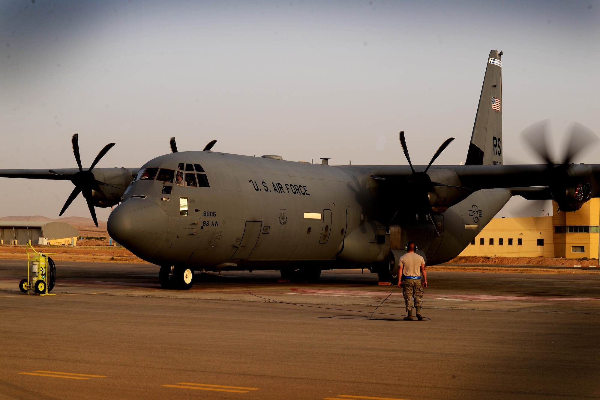 Airmen assigned to the 86th Aircraft Maintenance Squadron, 86th Airlift Wing, Ramstein Air Base, Germany, conduct a test of a C-130J Super Hercules engine prior to a sortie in support of exercise Juniper Falcon May 14, at Nevatim Air Force Base, Israel. Juniper Falcon 17 represents the combination of several bi-lateral component exercises with Israel Defense Forces that have been executed annually since 2011. These exercises were combined to increase joint training opportunities and capitalize on transportation and cost efficiencies gained by aggregating forces. (U.S. Air Force photo/ Tech. Sgt. Matthew Plew)