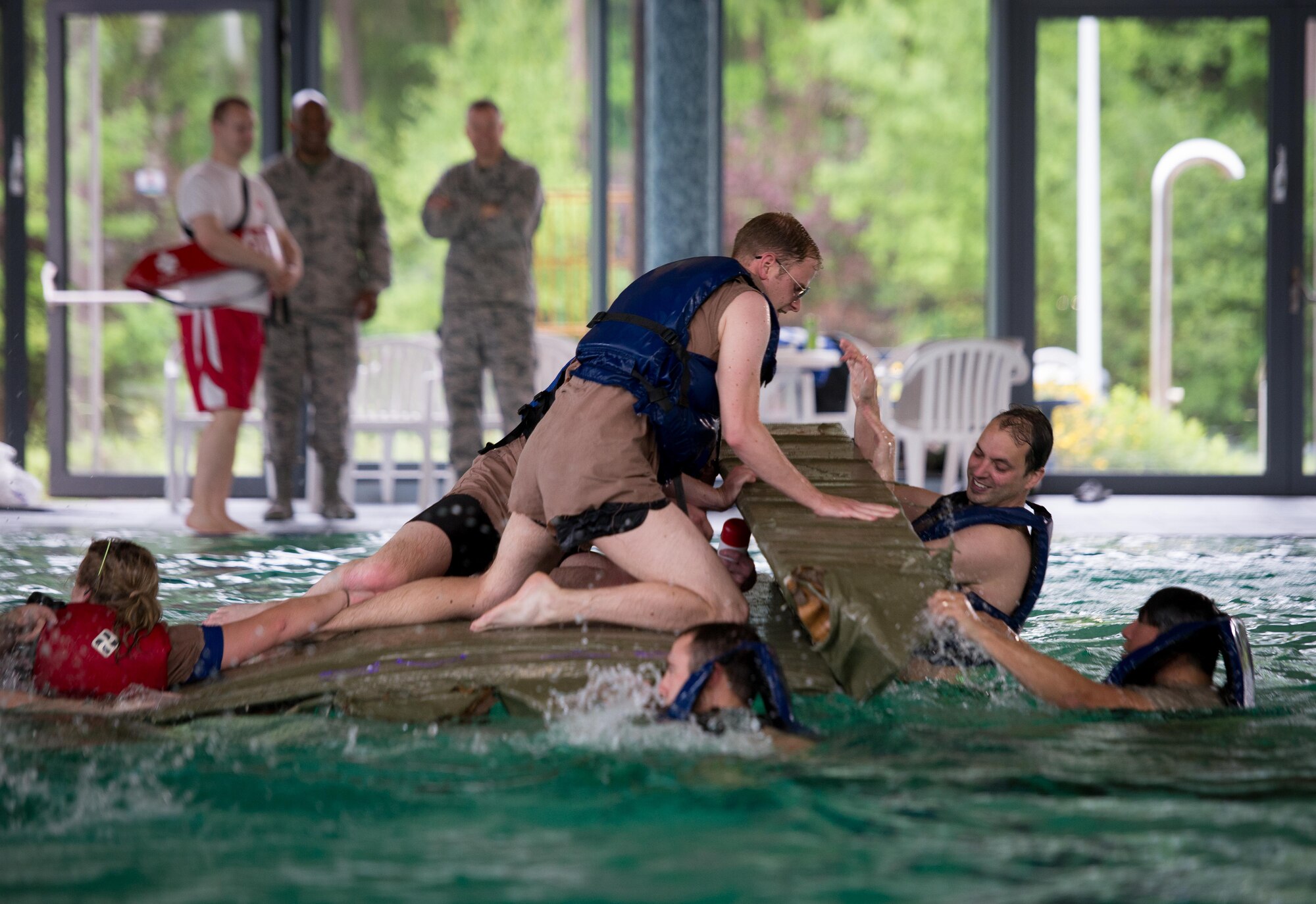 The 37th Airlift Squadron's 2017 Battle of the Battleships team, Cloud Surfers, defends their battleship during the "Last Ship Standing" event on Ramstein Air Base, May 19, 2017. Those battleships which survived the speed race went on to compete in the next event, where teams attempted to keep their vessel afloat while sinking the opposing team's ship. The 86th Force Support Squadron Ramstein Aquatic Center hosts Battle of the Battleships annually to foster community and morale in the Kaiserslautern Military Community.