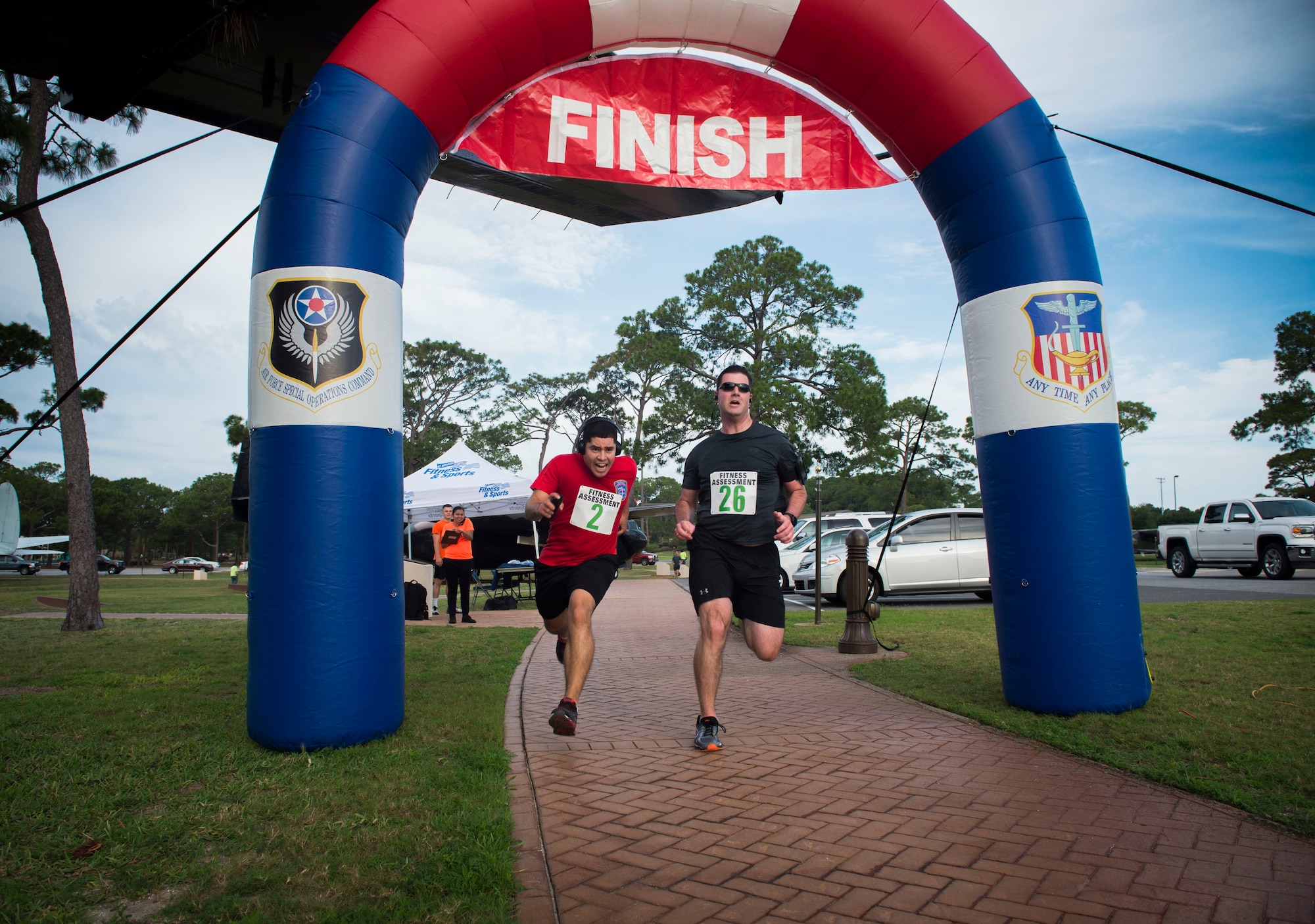 Runners race to the finish line during the 2nd Annual Run to Honor event at Hurlburt Field, Fla., May 18, 2017. Air Force Special Operations Command Families Forever Program and the 1st Special Operations Force Support Squadron hosted the 2nd Annual Run to Honor 5k ruck, 5k and 10k. (U.S. Air Force photo by Senior Airman Krystal M. Garrett) 