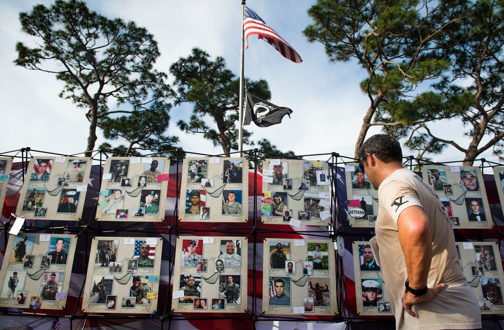 An Air Commando looks at the memorial wall during the 2nd Annual Run to Honor event at Hurlburt Field, Fla., May 18, 2017. Run to Remember gives Team Hurlburt the opportunity to honor their fallen brothers and sisters or a family member they have lost while on active duty. (U.S. Air Force photo by Senior Airman Krystal M. Garrett) 