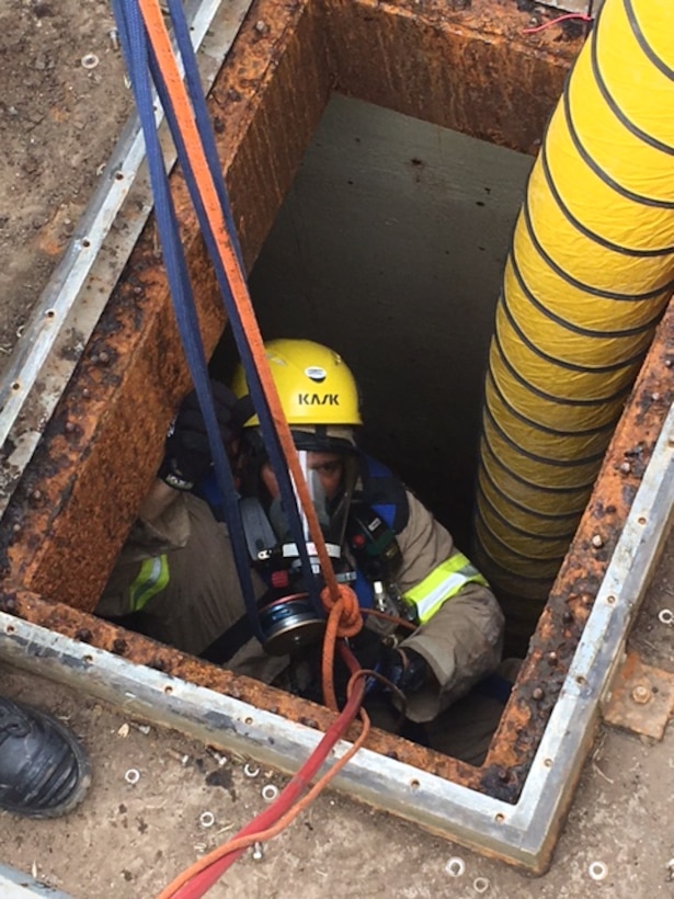 Los Angeles Fire Department crew member ascending into DFSP San Pedro Tank 15 during confined space and rescue training. 