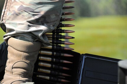 Staff Sgt. Devron West, a chemical, biological, radiological and nuclear specialist with the U.S. Army Reserve’s 300th Chemical Company from Morgantown, West Virginia, loads ammunition in the M2 .50 caliber machine gun May 19 during live-fire qualifications at Joint Base McGuire-Dix-Lakehurst, New Jersey.