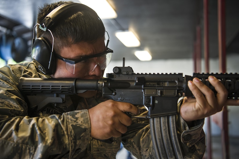 Staff Sgt. Mikhail Reyna-Maynez, 628th Communications Squadron cyber transport systems supervisor, fires his weapon during a competition at Joint Base Charleston, S.C., May 17, 2017. Several events, including a M4 carbine firing competition, were held in honor of Police Week.