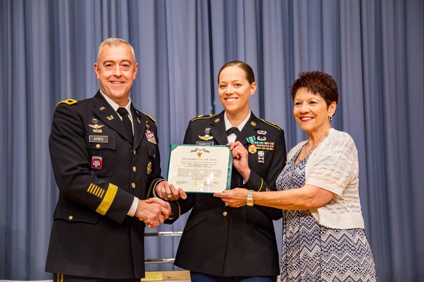 Staff Sgt. Sarah Hawley poses for a photo with and Ayres, Maj. Gen. Thomas E. Ayres, Deputy Judge Advocate General and Sgt. Eric L. Coggins' mother, Janice Waugh. (photo by Lt. Col. Arthur L. Rabin, U.S. Army Reserve Legal Command )