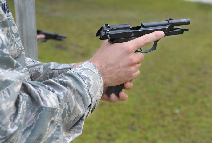 Master Sgt. Chris Moffett, 628th Civil Engineer Squadron heavy repair superintendent, loads his weapon during a shooting competition at Joint Base Charleston-Weapons Station, S.C., May 18, 2017. Several events, including an M9 pistol firing competition, were held in honor of Police Week. 