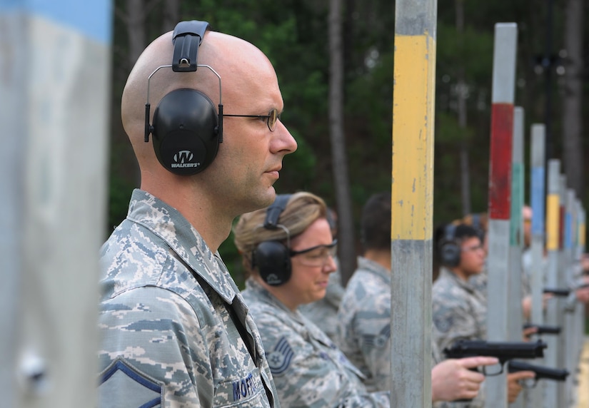 Master Sgt. Chris Moffett, 628th Civil Engineer Squadron heavy repair superintendent, waits for the order to fire during a shooting competition at Joint Base Charleston-Weapons Station, S.C., May 18, 2017. Several events, including an M9 pistol firing competition, were held in honor of Police Week. 