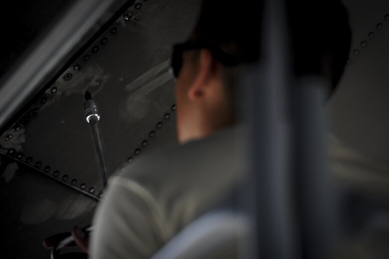 Airman 1st Class Daniel Goerdt, a crew chief with the 4th Aircraft Maintenance Unit, installs a flat baffle into the wing of an AC-130U Spooky gunship at Hurburt Field, Fla., May 19, 2017. Flat baffles are replaced on wings of aircraft to improve in-flight aerodynamics. (U.S. Air Force photo by Airman 1st Class Dennis Spain)