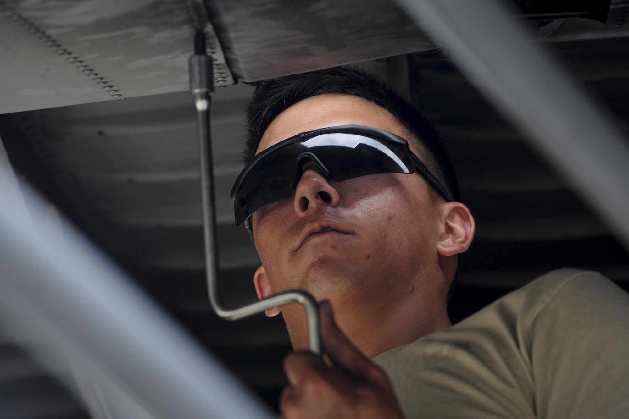 Airman 1st Class Daniel Goerdt, a crew chief with the 4th Aircraft Maintenance Unit, installs a flat baffle into the wing of an AC-130U Spooky gunship at Hurburt Field, Fla., May 19, 2017. Flat baffles are replaced on wings of aircraft to improve in-flight aerodynamics. (U.S. Air Force photo by Airman 1st Class Dennis Spain)