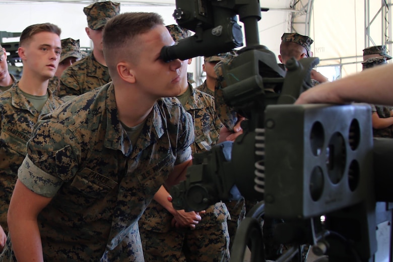 Pfc. Dylon Parker looks through the sights of an M777 155mm Howitzer during a field trip at Marine Corps Base Camp Lejeune, N.C., May 16, 2017. Marines assigned to the Marine Corps Air Station Cherry Point Squadron Intelligence Training Certification Course had the opportunity to visit various units stationed at MCB Camp Lejeune, N.C. and MCAS New River, N.C., in order to provide them a better understanding about capabilities and limitations of aircraft, weapons systems and vehicles their units may utilize. Parker is a student assigned to the MCAS Cherry Point SITCC program. (U.S. Marine Corps photo by Cpl. Mackenzie Gibson/Released)