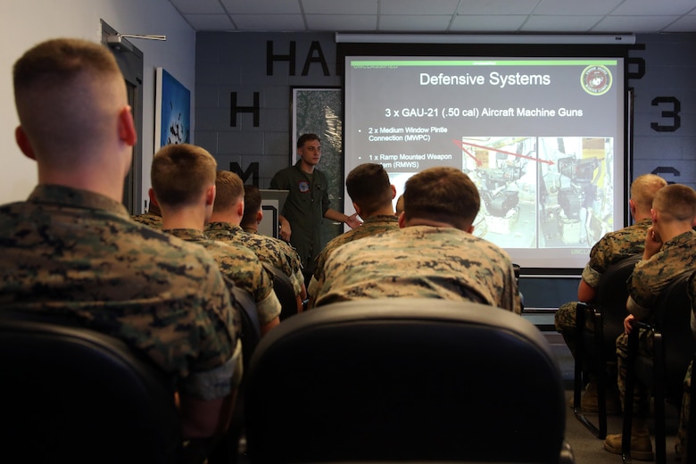 A Marine with Marine Heavy Helicopter Squadron 366, Marine Aircraft Group 14, 2nd  Marine Aircraft wing gives a class about the capabilities of the CH-53E Super Stallion during a field trip at Marine Corps Air Station New River, N.C., May 16, 2017. Marines assigned to the Marine Corps Air Station Cherry Point Squadron Intelligence Training Certification Course had the opportunity to visit various units stationed at MCB Camp Lejeune, N.C. and MCAS New River, N.C., in order to provide them a better understanding about capabilities and limitations of aircraft, weapons systems and vehicles their units may utilize. (U.S. Marine Corps photo by Cpl. Mackenzie Gibson/Released)