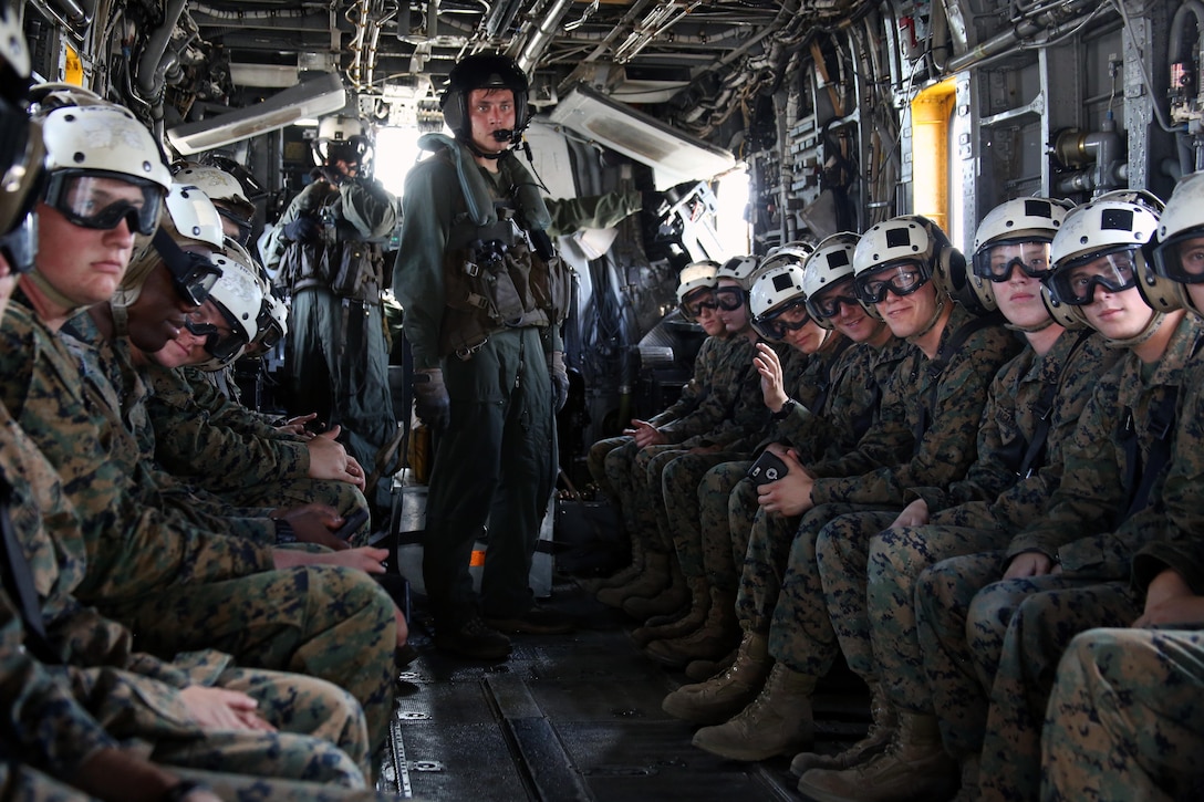A group of Marines ride in a CH-53E Super Stallion after a field trip at Marine Corps Air Station New River, N.C., May 16, 2017. Marines assigned to the Marine Corps Air Station Cherry Point Squadron Intelligence Training Certification Course had the opportunity to visit various units stationed at MCB Camp Lejeune, N.C. and MCAS New River, N.C., in order to provide them a better understanding about capabilities and limitations of aircraft, weapons systems and vehicles their units may utilize. (U.S. Marine Corps photo by Cpl. Mackenzie Gibson/Released)