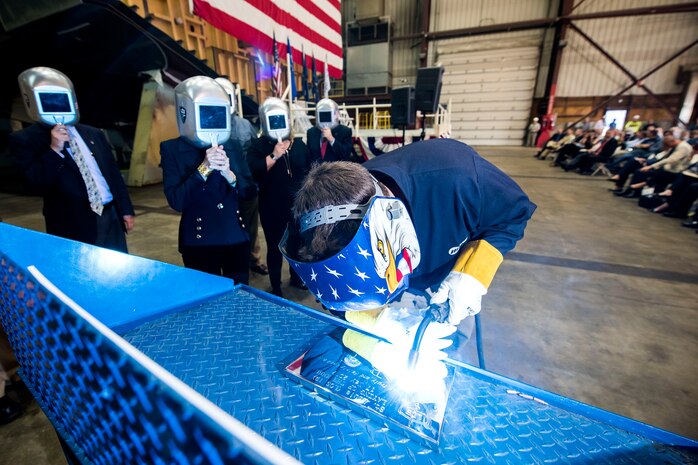 The initials of the ship’s sponsor, Barbara Taylor, were welded onto a keel plate that will be permanently affixed to the future USS St. Louis (LCS 19) in Marinette, Wisconsin, May 19.