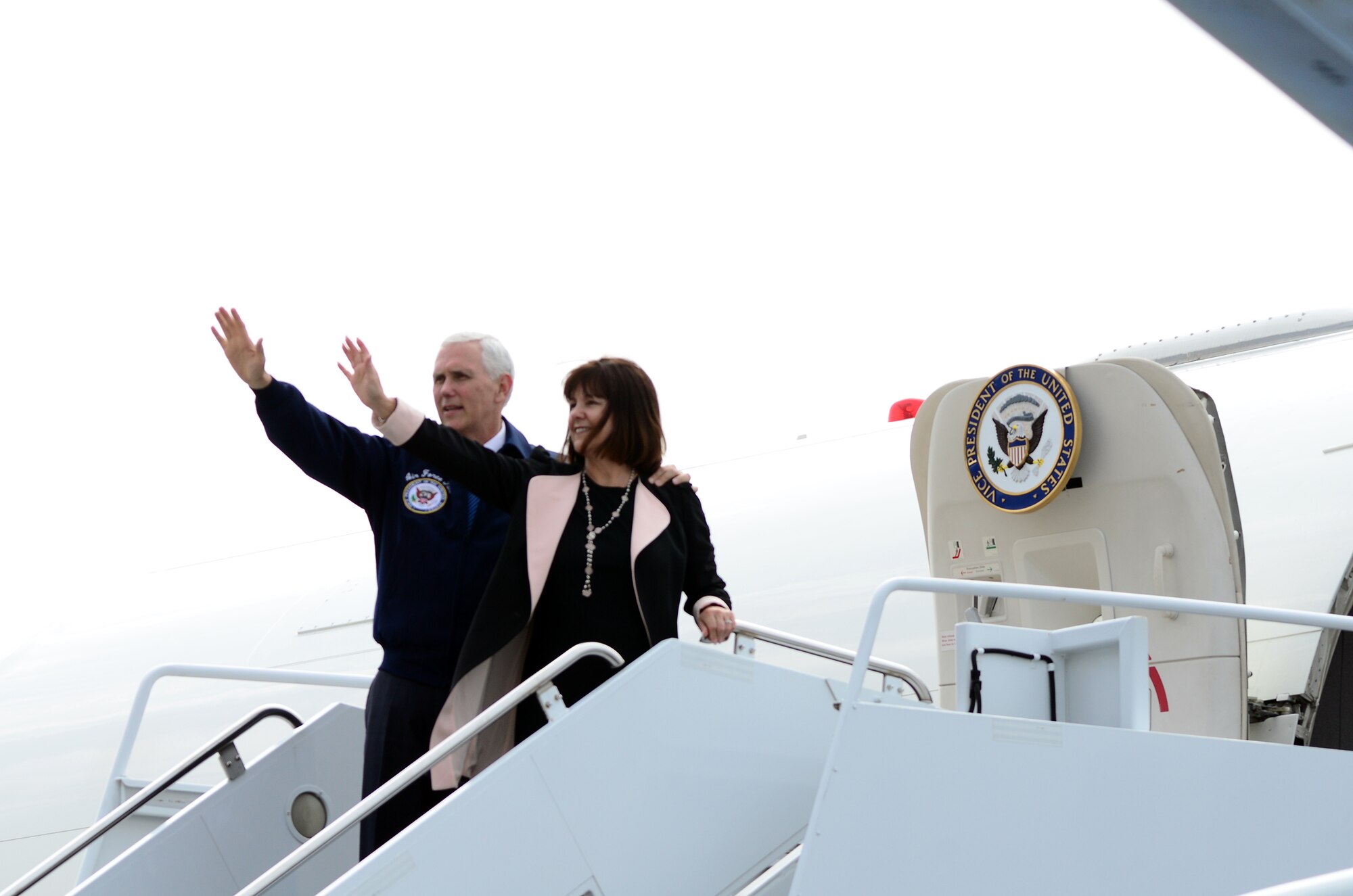 Vice President Mike Pence and his wife, Karen, wave goodbye as they prepare to depart Wright-Patterson Air Force Base, Ohio May 20, 2017 after speaking to more than 250 Wright Patt Airmen and their families for Armed Forces Day. The event was held inside a 445th Airlift Wing hangar. (U.S. Air Force photo/Tech. Sgt. Anthony Springer)