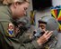 U.S. Air Force Senior Airman Darrian Caskey, School of Aerospace Medicine operational physiology technician, performs a seal check on the mask of 1st Lt. Alex Medina, USAFSAM student in the altitude hypobaric chamber for USAFSAM hypoxia demo training at Wright-Patterson Air Force Base, Ohio, April 26, 2017. The exposure to a low barometric pressure environment helps students recognize personal hypoxia symptoms as well as physical effects of pressure change at various training altitudes. (U.S. Air Force photo/Michelle Gigante)