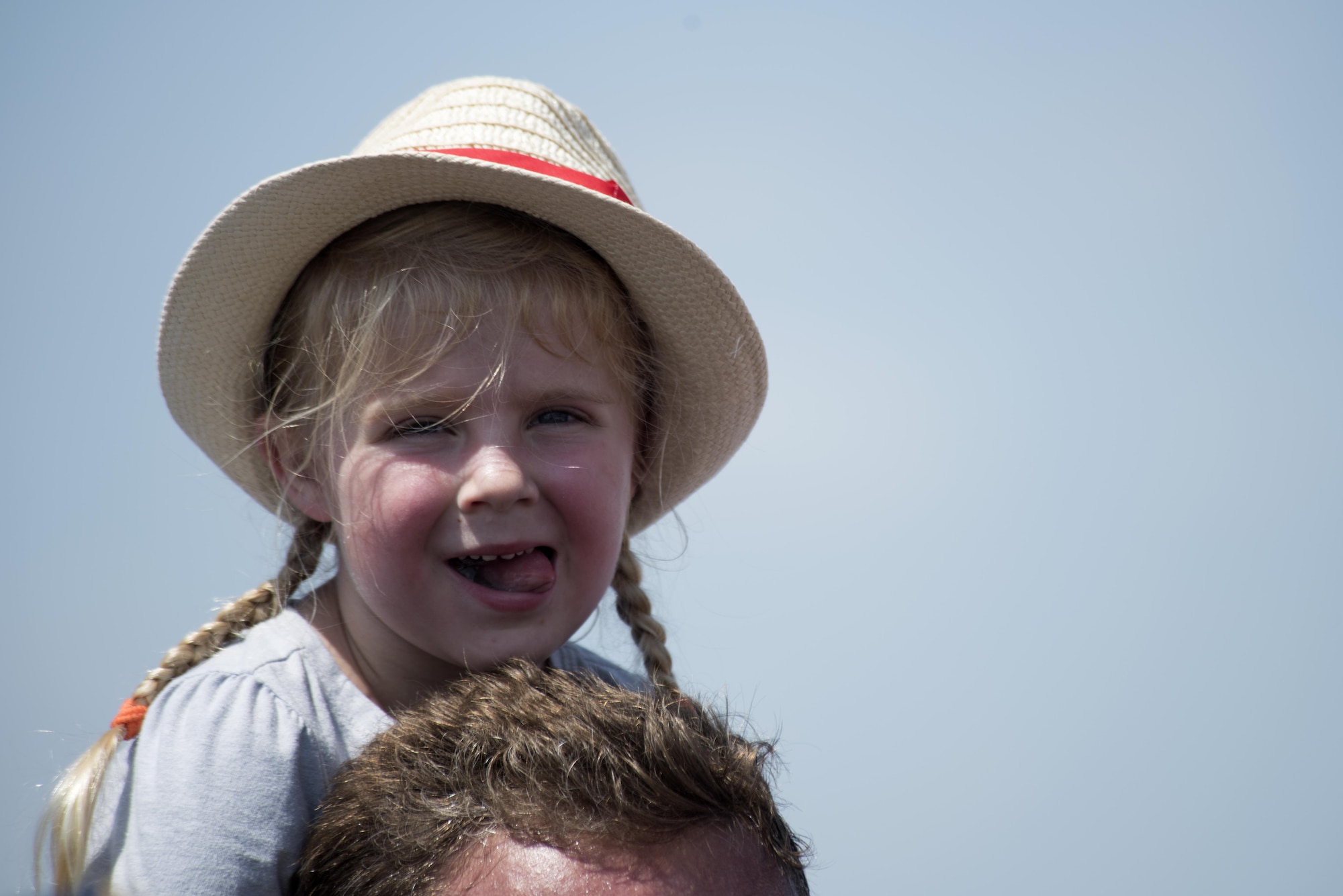 An attendee of the Wings Over Wayne Air Show prepares to watch aerial performances overhead, May 20, 2017, at Seymour Johnson Air Force Base, North Carolina. Seymour Johnson AFB opened its gates to the public for a free, two-day event as a way to thank local community members for their ongoing support of the base's mission. (U.S. Air Force photo by Airman Shawna L. Keyes)
