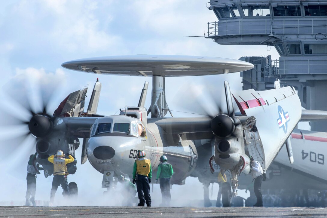 Sailors prepare to launch an E-2D Hawkeye aircraft from the flight deck of the aircraft carrier USS Ronald Reagan in the waters south of Japan, May 19, 2017. The crew is assigned to Airborne Early Warning Squadron 125. Navy photo by Petty Officer 2nd Class Nathan Burke