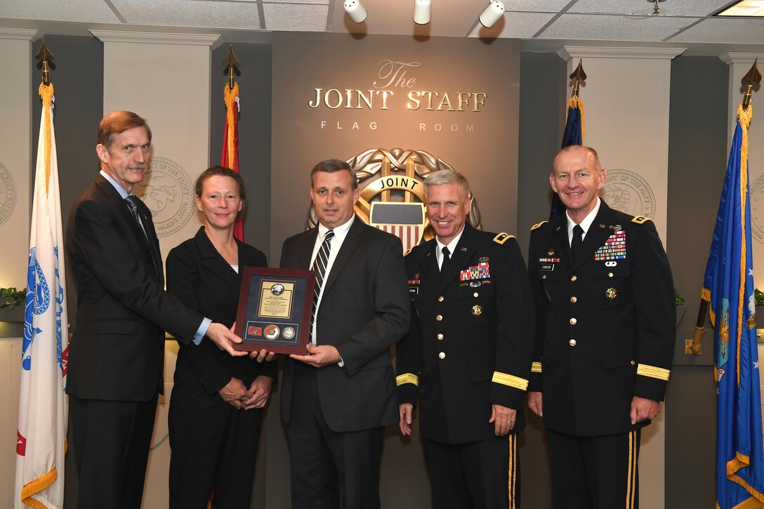 Karl F. Schneider (Left), senior career official performing the duties of the Under Secretary of the Army, host of the 2016 Lean Six Sigma excellence awards program ceremony May 18, 2017 at the Pentagon in Arlington, Va., poses with Diane Parks (Second from left), U.S. Army Corps of Engineers Nashville District chief of Operations, Tim Dunn (Third from left), Nashville District deputy chief of Operations, and Maj. Gen. Richard L. Stevens, (Fourth from left) U.S. Army Corps of Engineers deputy commanding general, and Lt. Gen. Edward C. Cardon, director of the Office of Business Transformation. Parks and Dunn accepted the Army’s Lean Six Sigma Award Program Process Improvement Project Team Excellence Award. (U.S. Army photo by Leroy Council)