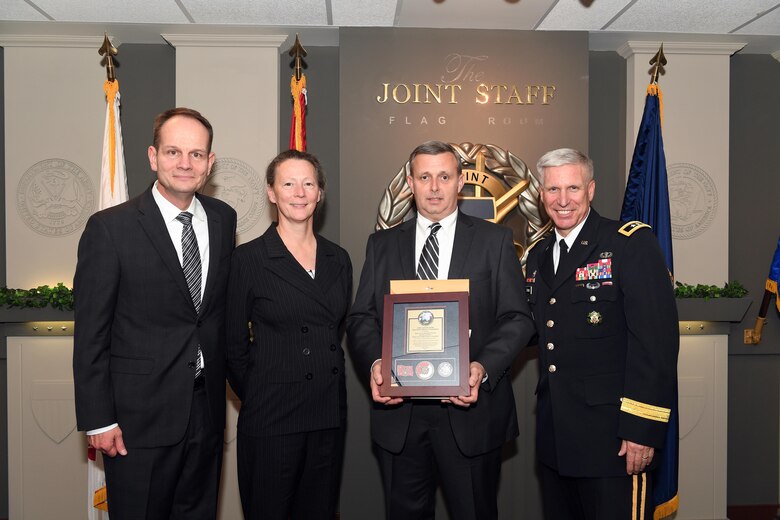 Karl F. Schneider (Left), senior career official performing the duties of the Under Secretary of the Army, host of the 2016 Lean Six Sigma excellence awards program ceremony May 18, 2017 at the Pentagon in Arlington, Va., poses with Diane Parks (Second from left), U.S. Army Corps of Engineers Nashville District chief of Operations, Tim Dunn (Third from left), Nashville District deputy chief of Operations, and Maj. Gen. Richard L. Stevens, U.S. Army Corps of Engineers deputy commanding general. Parks and Dunn accepted the Army’s Lean Six Sigma Award Program Process Improvement Project Team Excellence Award.