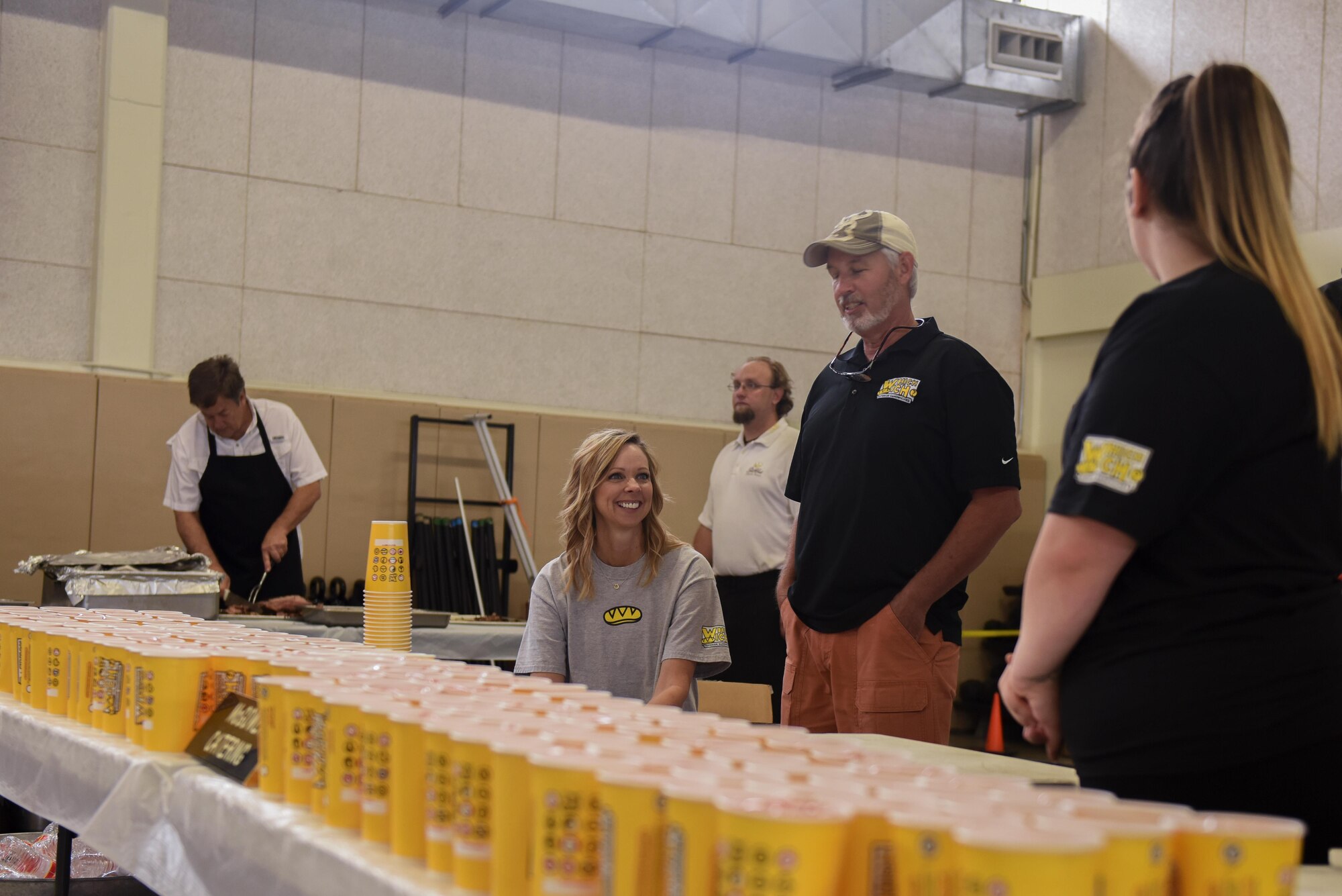 Volunteers distribute drinks for Goodfellow members for Goodfellow Appreciation Day at the Carswell Field House on Goodfellow Air Force Base, Texas, May 20, 2017. The event was catered by various San Angelo restaurants. (U.S. Air Force photo by Airman 1st Class Chase Sousa/Released)