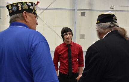 Simon Michael Frost, a high school senior from Adams, Wis., speaks with Vietnam veterans during an “Our Community Salutes” event at Fort McCoy, Wisconsin on Armed Forces Day, May 20. Frost enlisted in the U.S. Army Reserve as an infantryman and will leave for basic training in late August.