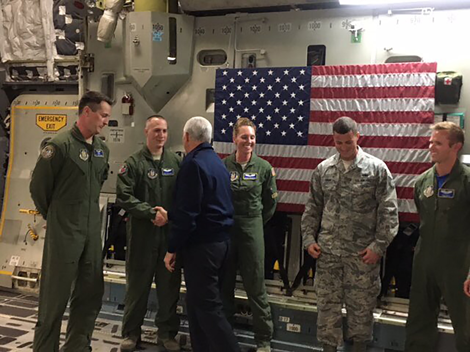 Vice President Mike Pence and his wife, Karen, meet with Airmen from the 445th Airlift Wing during a tour of one of the wing's C-17 Globemaster III. From left to right meeting the vice president are 89th Airlift Squadron loadmaster Staff Sgt. Jason Benedict, 445th Aeromedical Evacuation Squadron medical technician Master Sgt. Sean Smith, 445 AES flight nurse 1st Lt. Stacey Blurton, 445th Aircraft Maintenance Squadron crew chief Staff Sgt. David Smart and 89 AS pilot Capt. Paul Kolk. Chief Master Sgt. Nathan Wilson, 445 AMXS superintendent, was also on board to explain to the vice president the mechanics of the C-17. (Courtesy photo)  