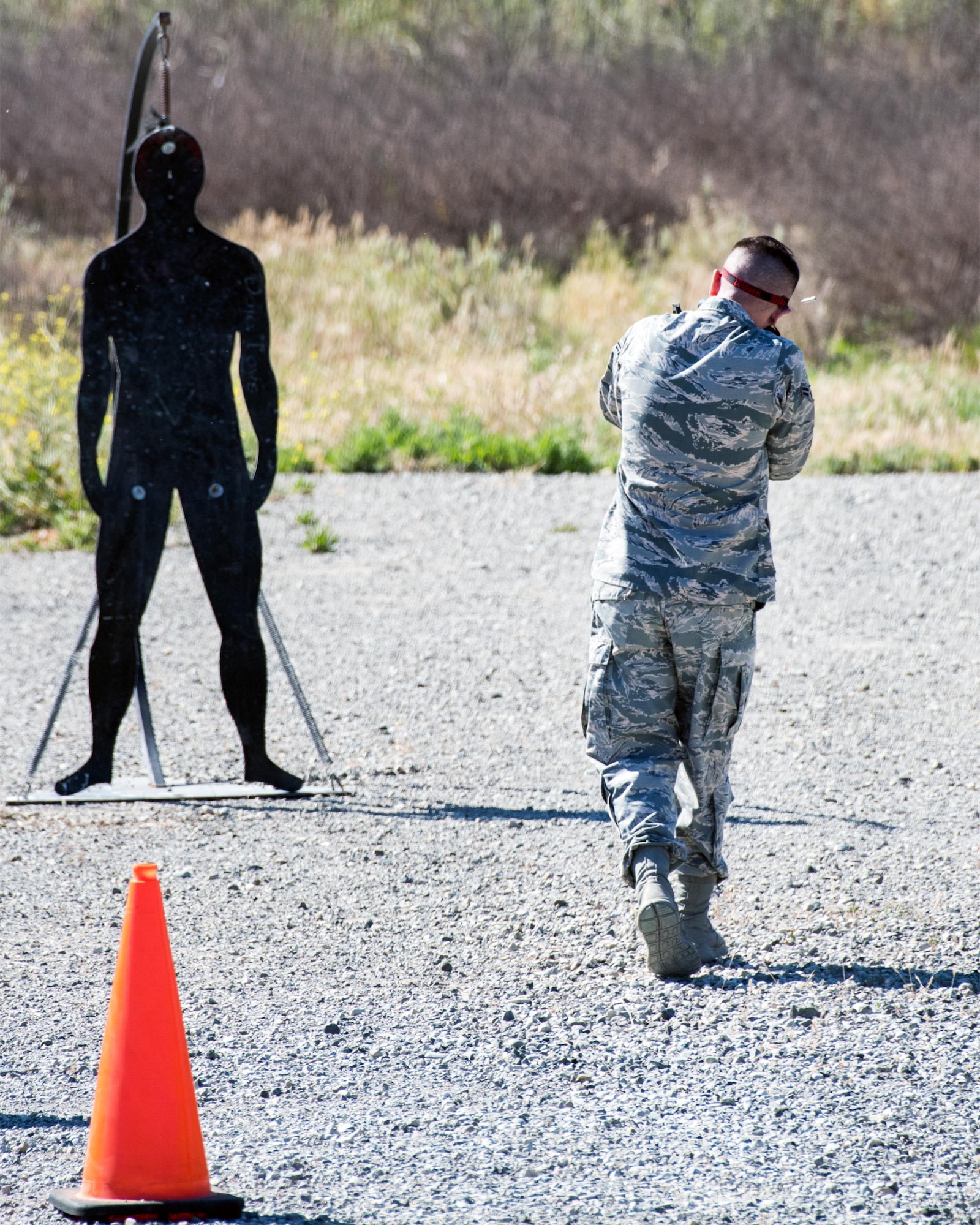 Defenders from the 60th Security Forces Squadron, Travis Air Force Base, Calif., compete in a shooting competition May 18, 2017. The competition was one of several events sponsored by the squadron in honor of Police Week. (U.S. Air Force photo by Louis Briscese)
