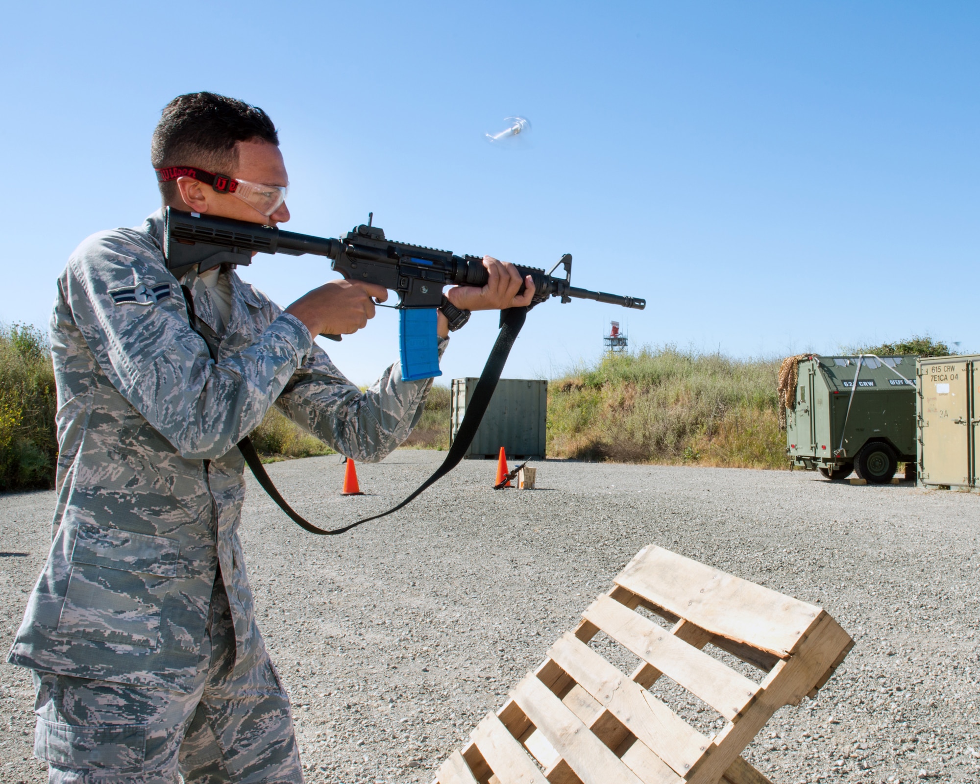 U.S. Air Force Airman 1st Class Joshua Adolf, 60th Security Forces Squadron, Travis Air Force Base, Calif., competes in a shooting competition May 18, 2017. The competition is jwas one of several events sponsored by the squadron in honor of Police Week. (U.S. Air Force photo by Louis Briscese)