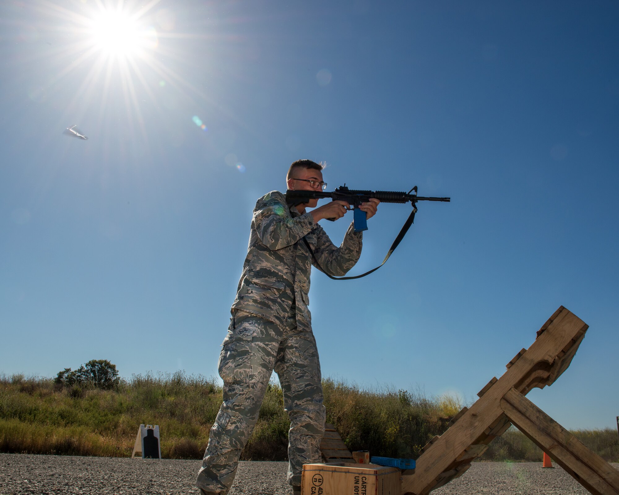 U.S. Air Force Airman 1st Class Joshua Adolf,60th Security Forces Squadron, Travis Air Force Base, Calif., competes in a shooting competition May 18, 2017. The competition was one of several events sponsored by the squadron in honor of Police Week. (U.S. Air Force photo by Louis Briscese)