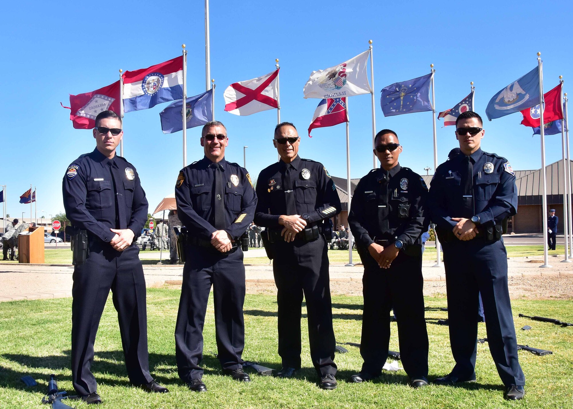 Local police officers and Citizen Airmen from the 944th Fighter Wing pose for a photo prior to the S.S. Mayaguez retreat ceremony May 18 at Luke Air Force Base, Ariz. (U.S. Air Force photo by Tech. Sgt. Louis Vega Jr.)