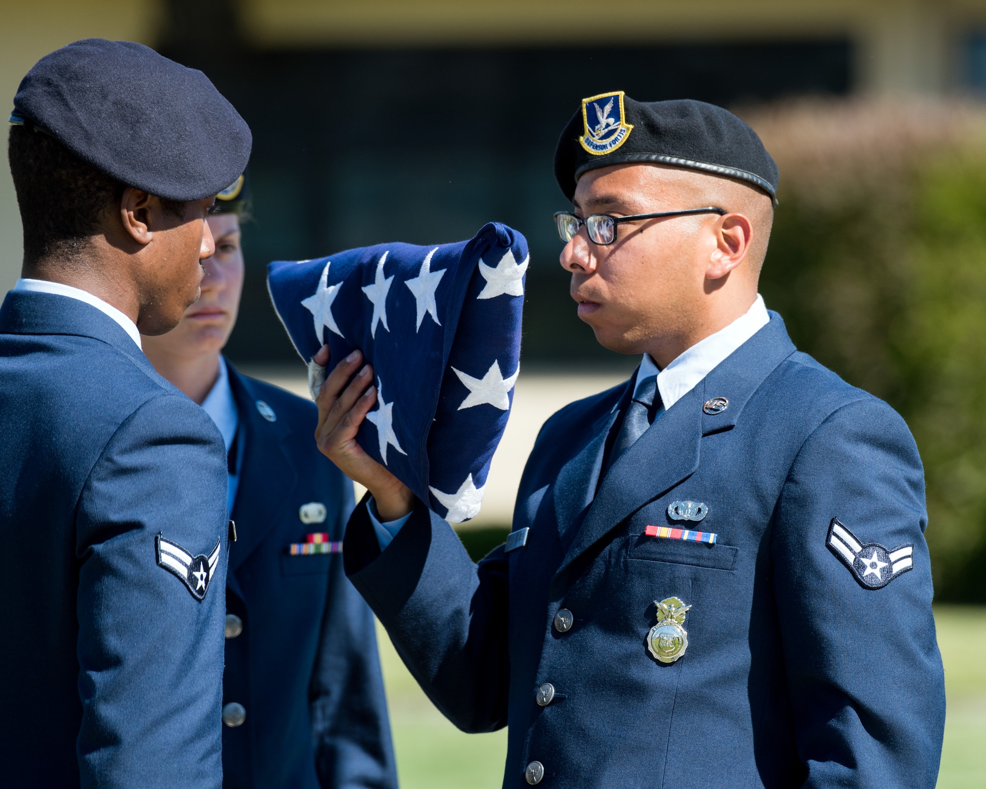 Defenders from the 60th Security Forces Squadron, Travis Air Force Base, Calif., perform a retreat ceremony, May 18, 2017. The ceremony was one of several events sponsored by the squadron in honor of Police Week. (U.S. Air Force photo by Louis Briscese)
