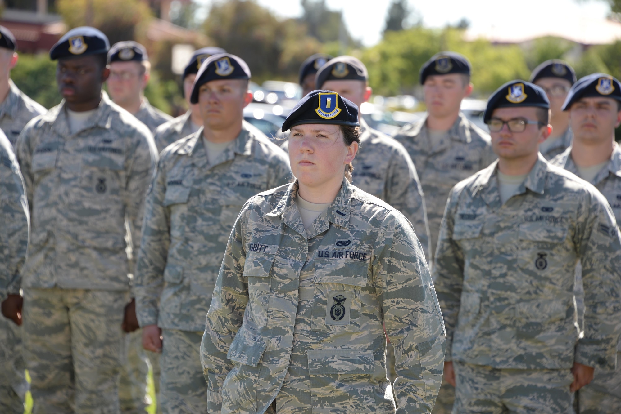1 st Lt. Adrienne Nesbitt, 60th Security Forces Squadron, leads a formation of defenders during a retreat ceremony featuring security forces Airmen to close Police Week May 18, 2017 at Travis Air Force Base, Calif. Established by a joint resolution of Congress in 1962, National Police Week pays special recognition to law enforcement officers who have lost their lives in the line of duty for the safety and protection of others. Police Week gives the 60th SFS an opportunity to inform, educate and strengthen Travis community relations. (U.S. Air Force photo/Tech. Sgt. James Hodgman) 