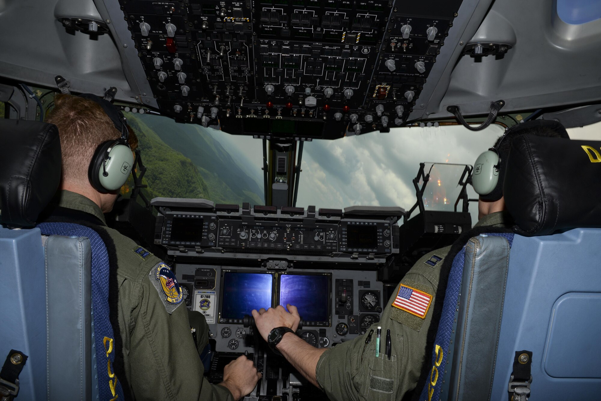 Capts. Ryan Nichol and Jeff Hogan, 3d Airlift Squadron pilots, perform low-level maneuvers May 15, 2017, aboard a C-17 Globemaster III over the Appalachian Mountains. Nichol and Hogan practiced precision flying as they headed to Moody Air Force Base, Ga., in preparation for Exercise RAPID RESCUE. (U.S. Air Force Photo by Senior Airman Aaron J. Jenne)