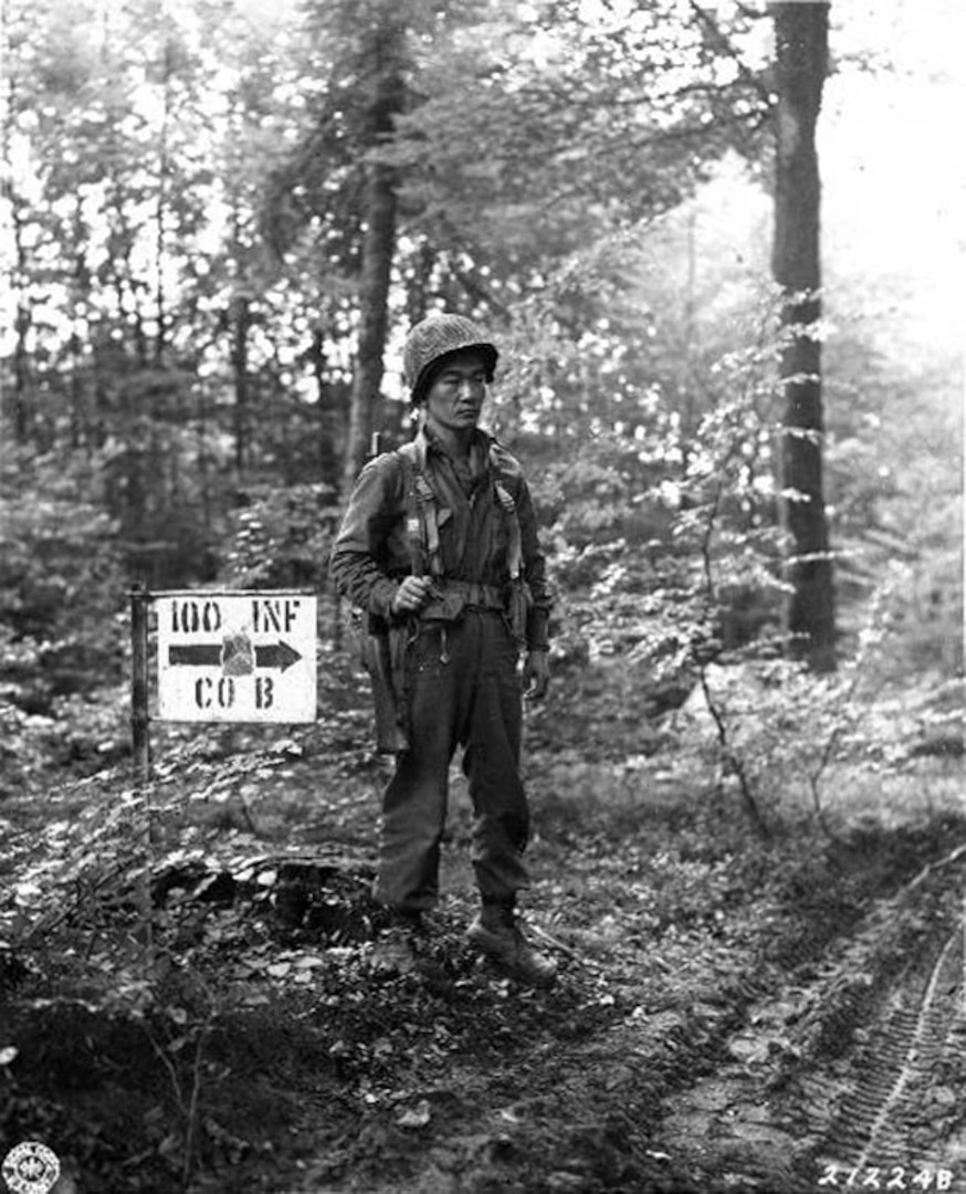 Army Staff Sgt. James S. Kawashime, with B Company, 100th Battalion, 442nd Regimental Combat Team, stands guard at a bivouac site in France in October 1944. Made up almost entirely of Nisei, or second generation Japanese-Americans, the origins of the 100th Bn., 442nd RCT began with the Hawaii Army National Guard. 