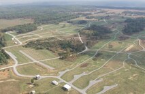 An arial view of the Qualification Training Range at Fort Knox, Kentucky. The road network servicing the training complex is a key support element of the training mission. The U.S. Army Engineering and Support Center, Huntsville is the designated the Range and Training Land Program Mandatory Center of Expertise and develops generic design manuals for Multi-Purpose Range Complexes