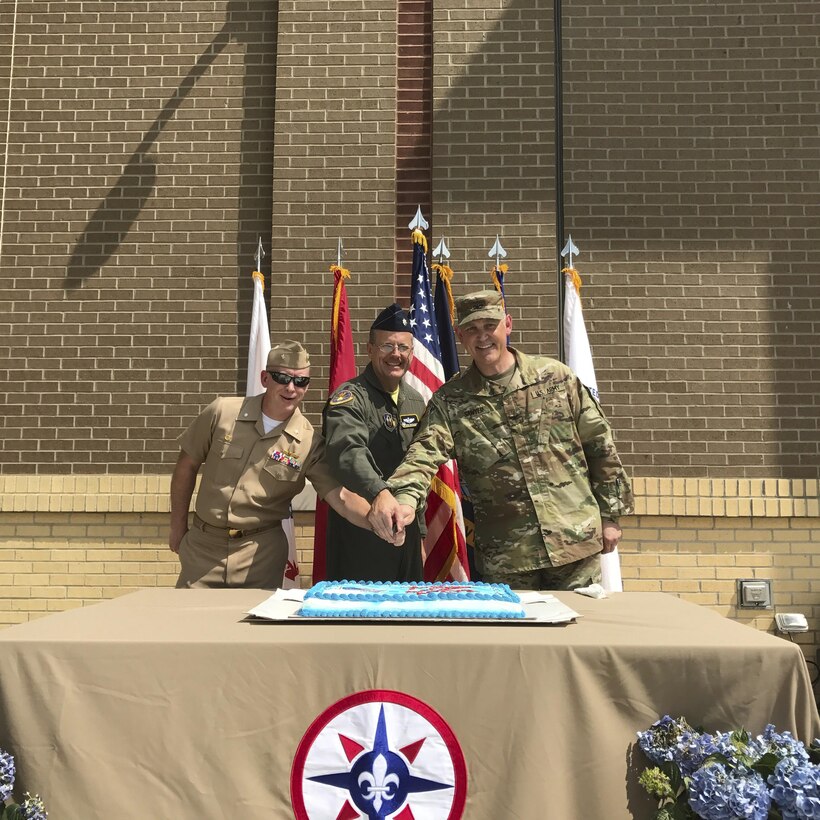 Col. Clifton Sawyer with the 316th MSE, Lt. Col. Gregory Buchanan with the 911th Air Wing, and Cmdr. Don Haley with the Navy Operational Support Center celebrate Armed Forces Day with a cake cutting.