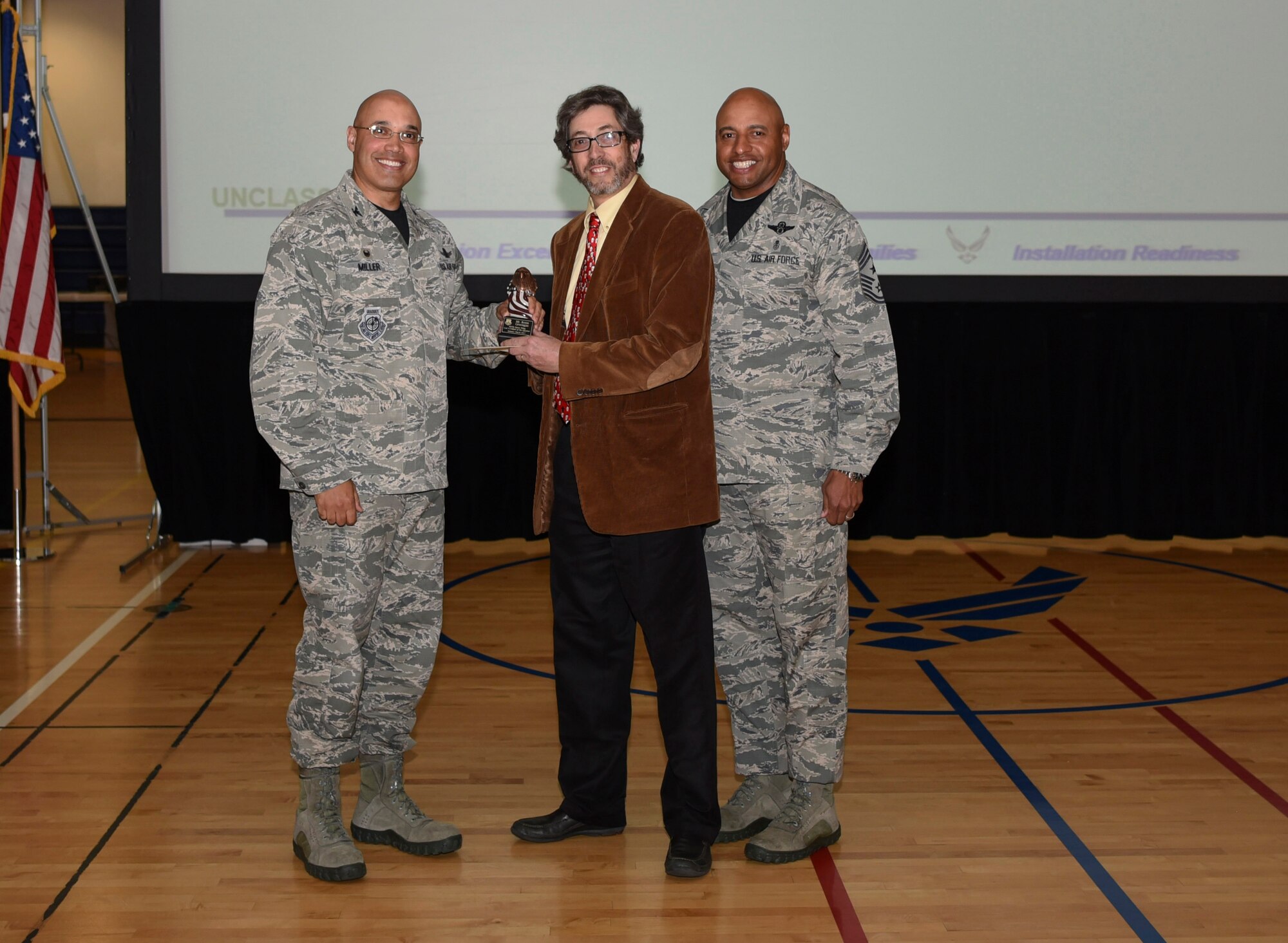 Ronn Greengas, 460th Force Support Squadron unit program coordinator, receives the Category I Non-Supervisory Civilian of the Quarter Award May 19, 2017, on Buckley Air Force Base, Colo.  Awards were given to the Team Buckley members who showed dedication, hard work and exceeded their supervisor’s expectations. (U.S. Air Force photo by Airman 1st Class Holden S. Faul/ Released)