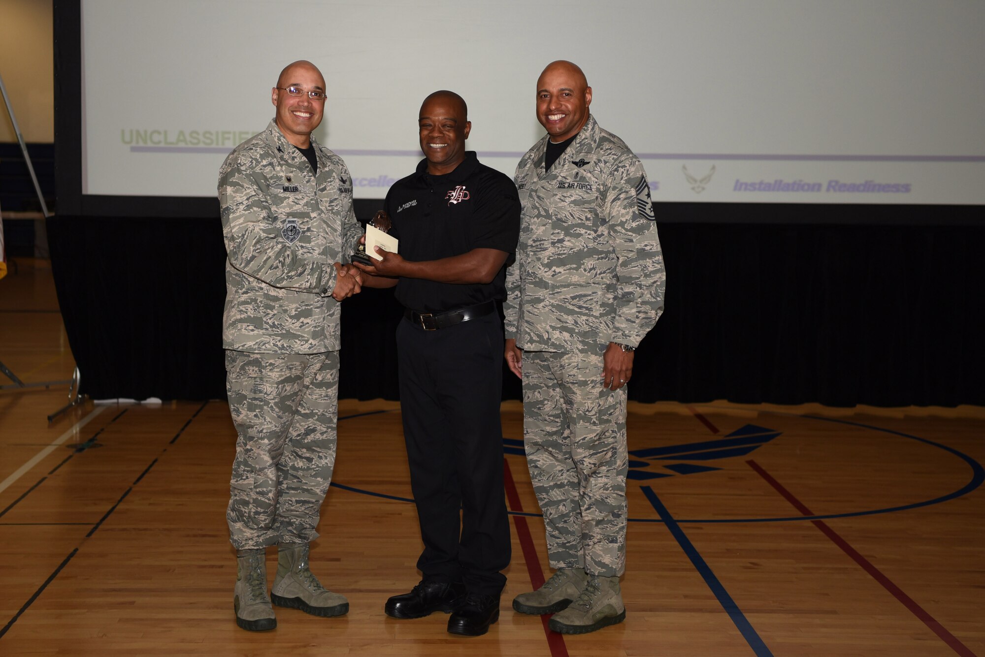 Andre Sanders, 460th Civil Engineer Squadron assistant chief of health and safety, receives the Category II Non-Supervisory Civilian of the Quarter Award May 19, 2017, on Buckley Air Force Base, Colo.  Awards were given to the Team Buckley members who showed dedication, hard work and exceeded their supervisor’s expectations. (U.S. Air Force photo by Airman 1st Class Holden S. Faul/ Released)