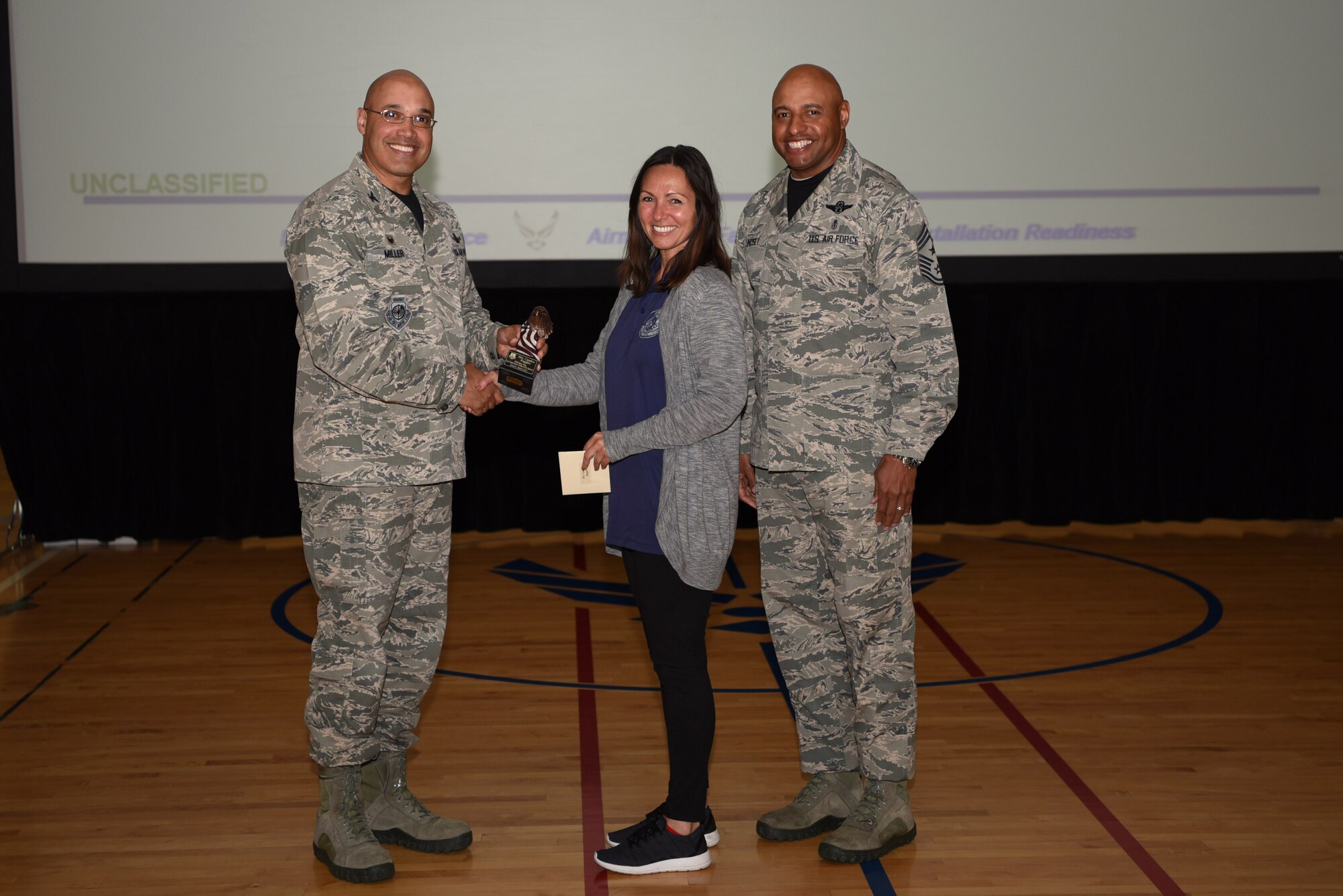 Candice Ruggles, 460th Force Support Squadron lead program technician, receives the Category I Supervisory Civilian of the Quarter Award May 19, 2017, on Buckley Air Force Base, Colo.  Awards were given to the Team Buckley members who showed dedication, hard work and exceeded their supervisor’s expectations. (U.S. Air Force photo by Airman 1st Class Holden S. Faul/ Released)