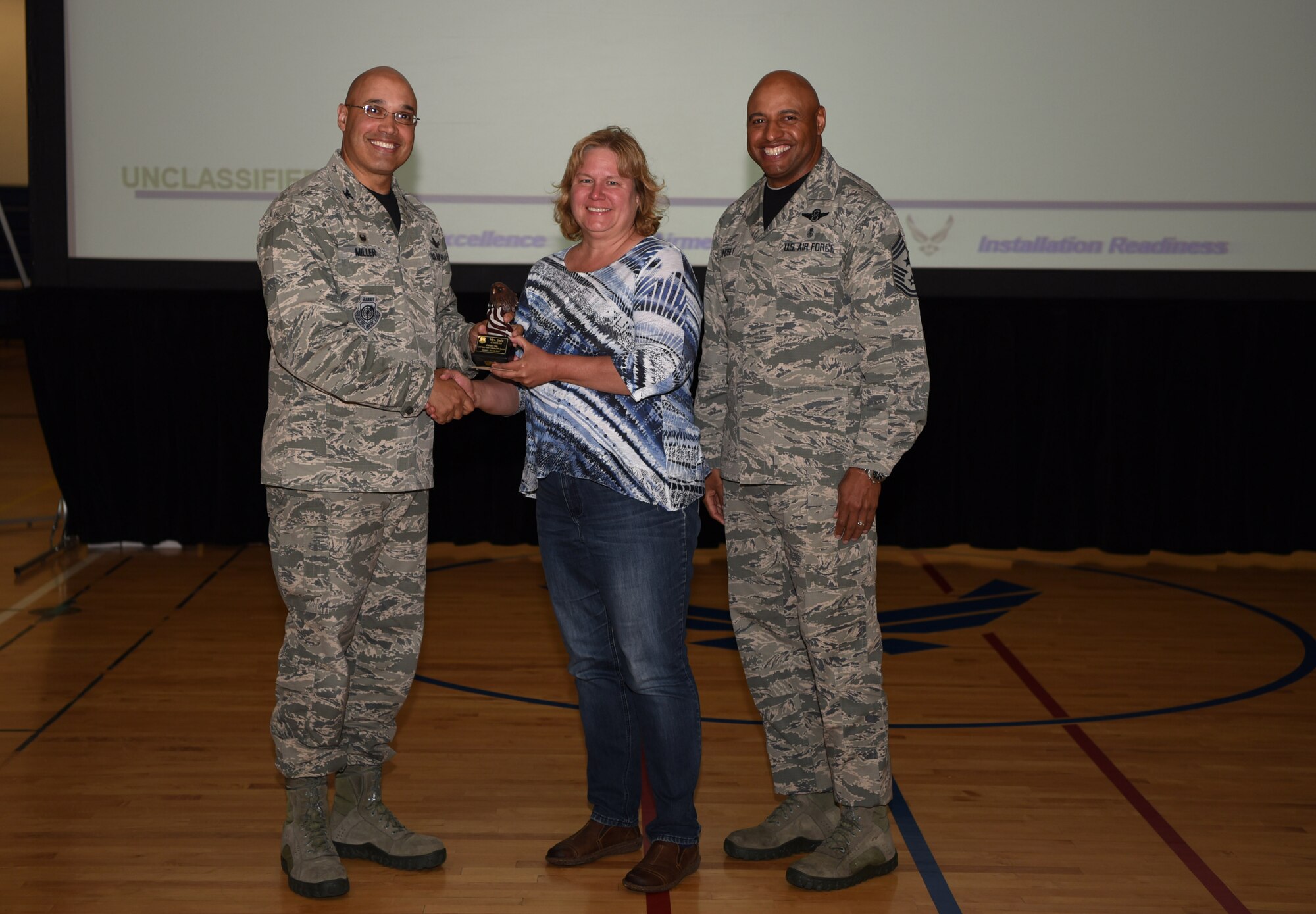 Judy Corizzo, 460th Comptroller Squadron budget officer, receives the Category II Supervisory Civilian of the Quarter Award May 19, 2017, on Buckley Air Force Base, Colo.  Awards were given to the Team Buckley members who showed dedication, hard work and exceeded their supervisor’s expectations. (U.S. Air Force photo by Airman 1st Class Holden S. Faul/ released)