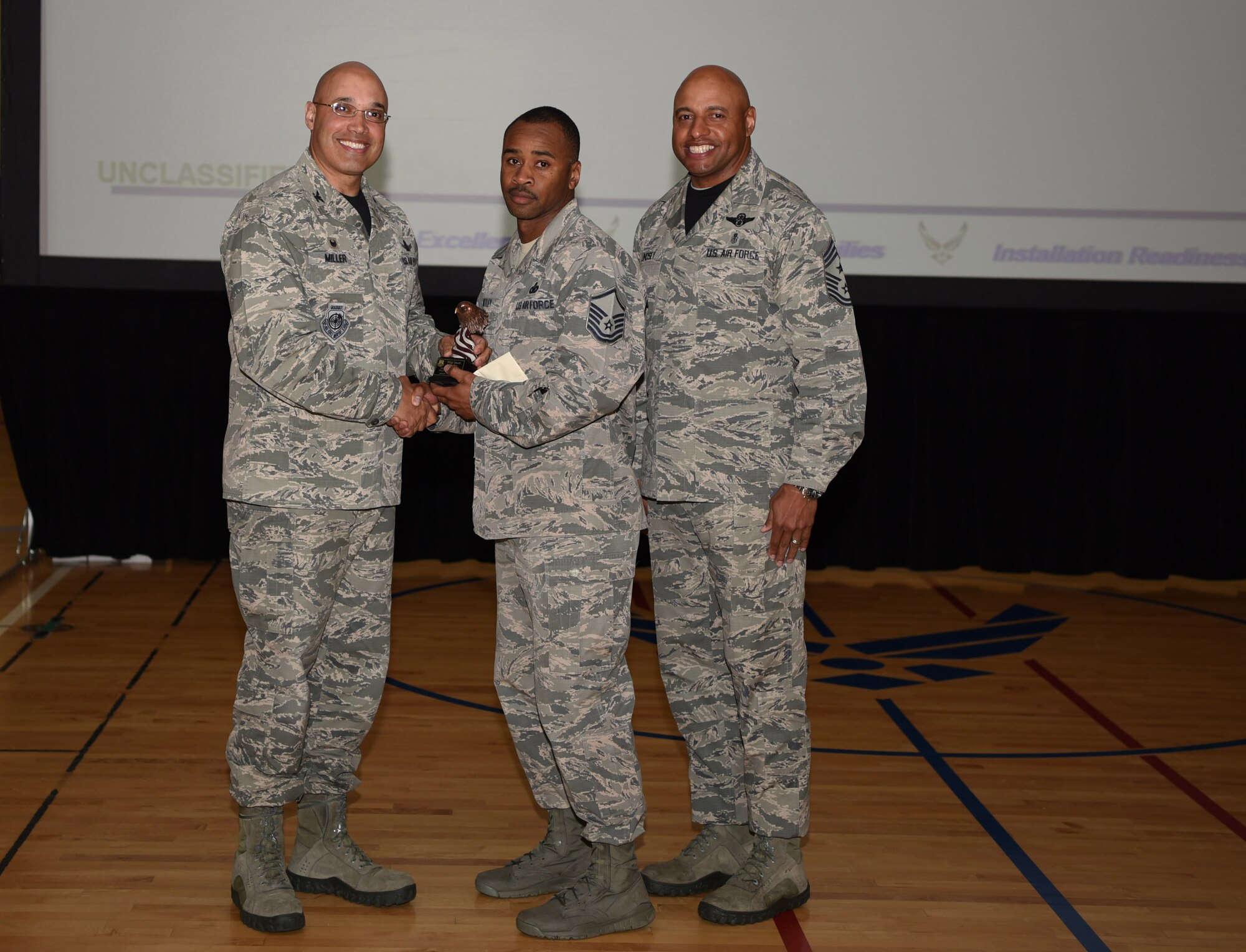 Master Sgt. Imari Motley, 460th Force Support Squadron Airman Leadership School commandant, receives the Senior Noncommissioned Officer of the Quart Award May 19, 2017, on Buckley Air Force Base, Colo.  Awards were given to the Team Buckley members who showed dedication, hard work and exceeded their supervisor’s expectations. (U.S. Air Force photo by Airman 1st Class Holden S. Faul/ released)