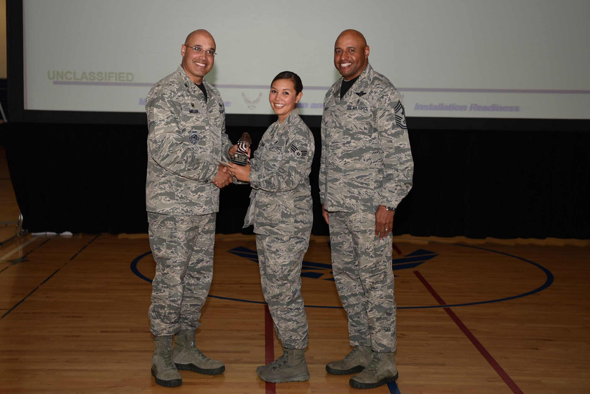 Senior Airman Amanda Kravchuk, 460th Space Wing general law paralegal, receives the Quarter Award May 19, 2017, on Buckley Air Force Base, Colo.  Awards were given to the Team Buckley members who showed dedication, hard work and exceeded their supervisor’s expectations. (U.S. Air Force photo by Airman 1st Class Holden S. Faul/ released)